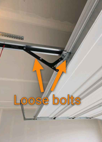 Loose garage door hardware found during a North Idaho home inspection by AIM Home Solutions